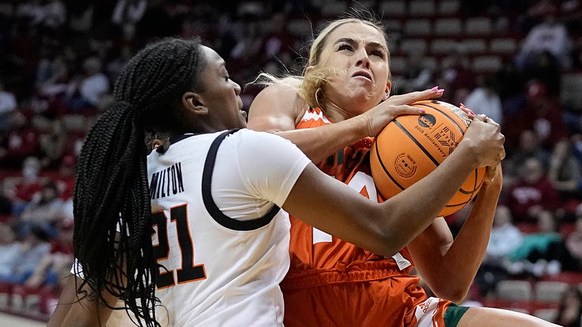 Hanna Cavinder drives to the basket