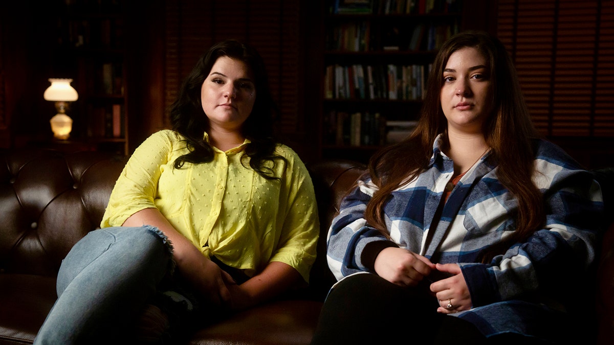 Christian Showalter and Hannah Parrett sitting on a sofa