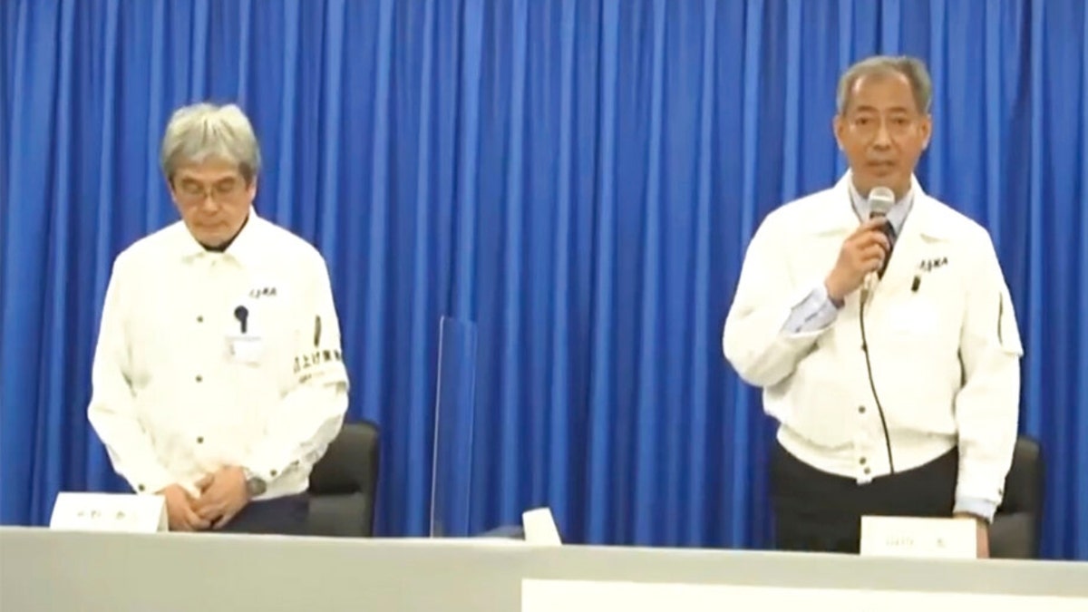 The president of JAXA and Yasuhiro Funo speak to reporters