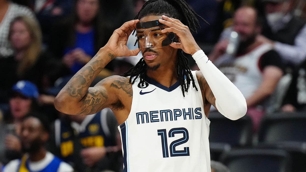 Ja Morant puts his hands on his head