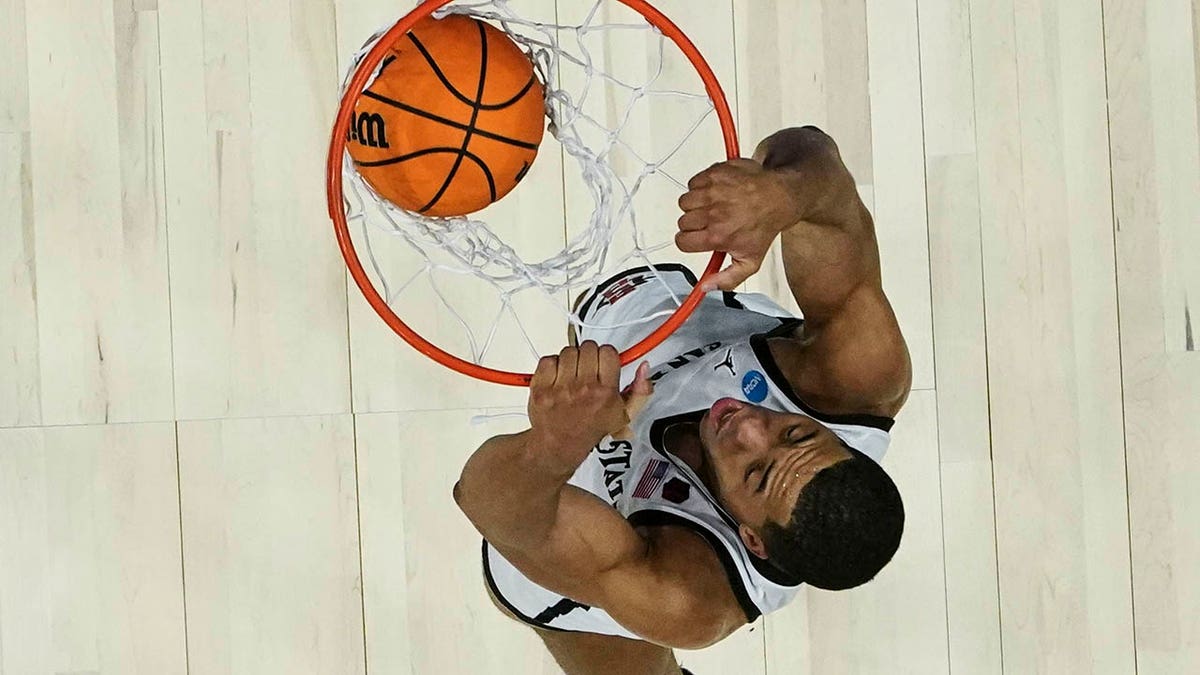 San Diego State forward Jaedon LeDee (13) dunks the ball against Creighton in the first half of a Elite 8 college basketball game in the South Regional of the NCAA Tournament, Sunday, March 26, 2023, in Louisville, Ky. (AP Photo/John Bazemore)