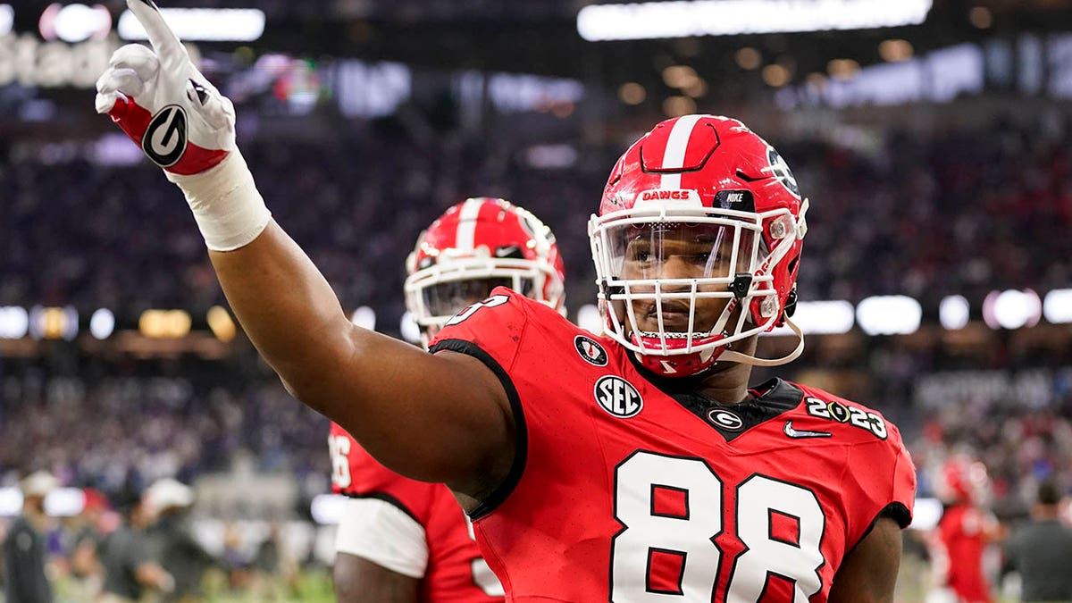 Jalen Carter waves to the crowd