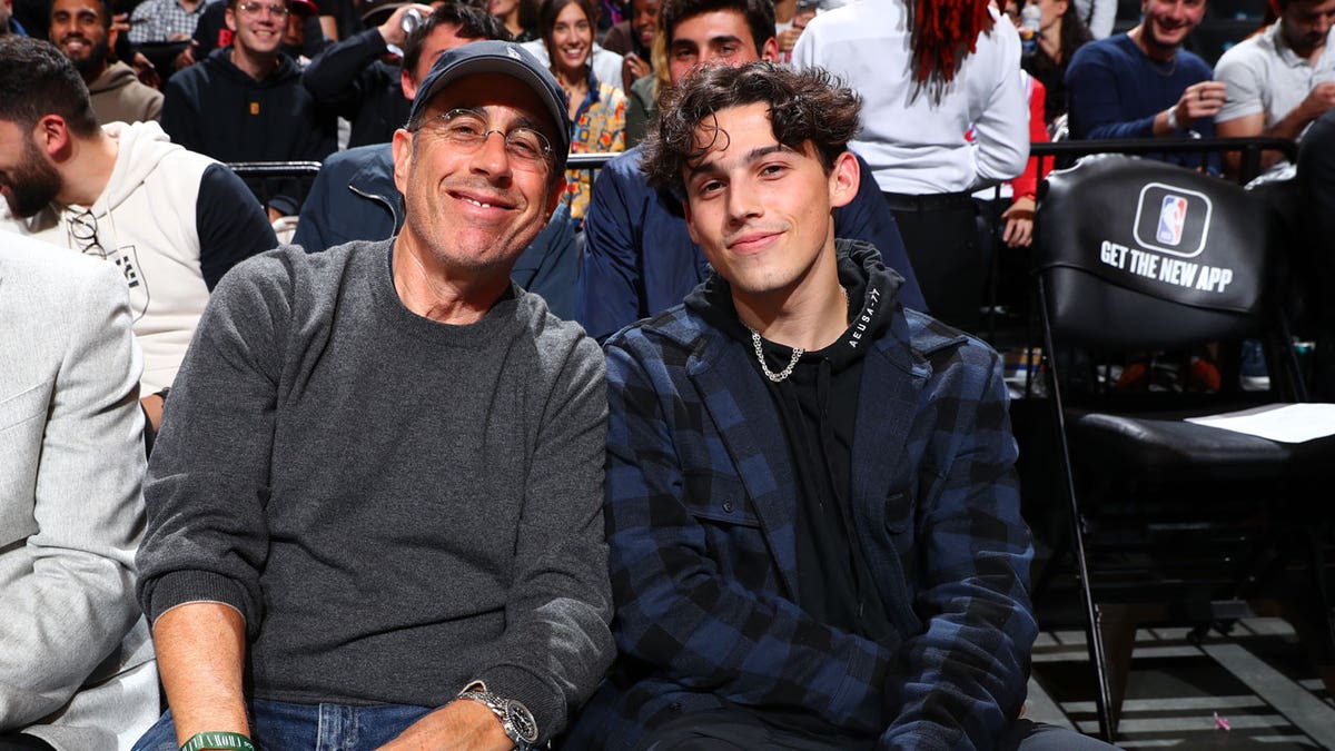 Jerry Seinfeld and his son at a basketball game