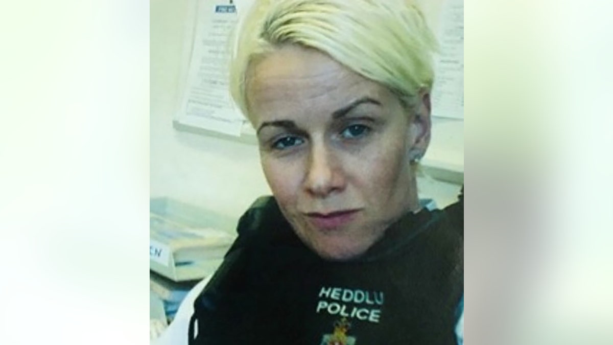 A close-up of Jill Owens in police uniform.