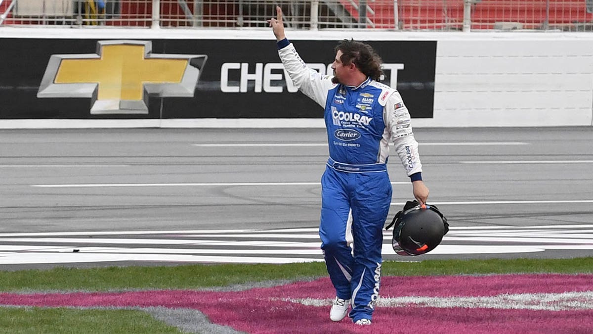 Josh Williams waves to the crowd