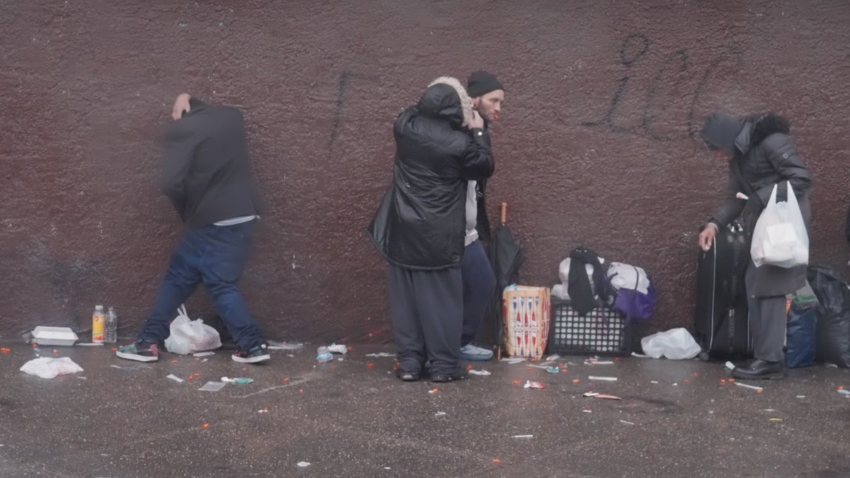 Philadelphia drug addicts line the sidewalk