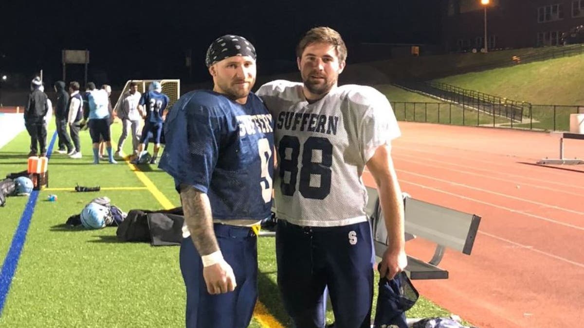 Nick and Doug Kantor in football uniforms on sideline