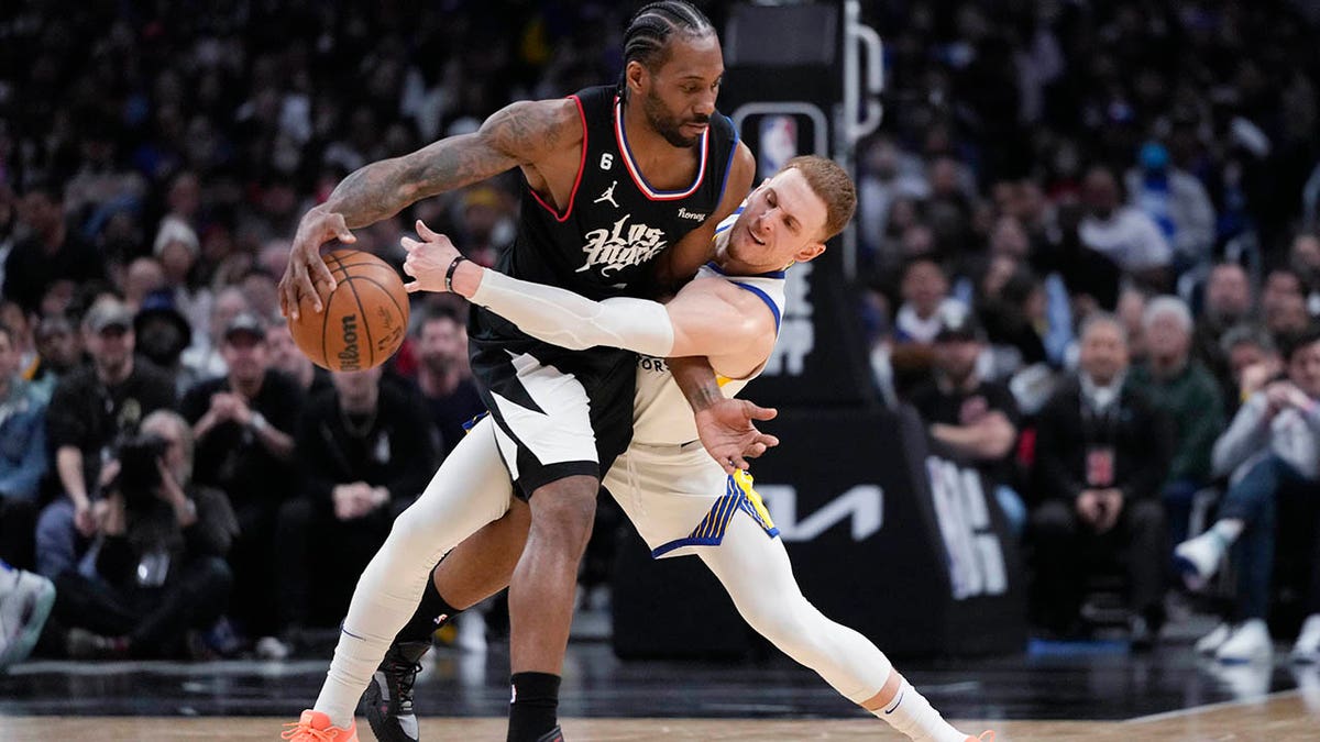 Kawhi Leonard dribbles