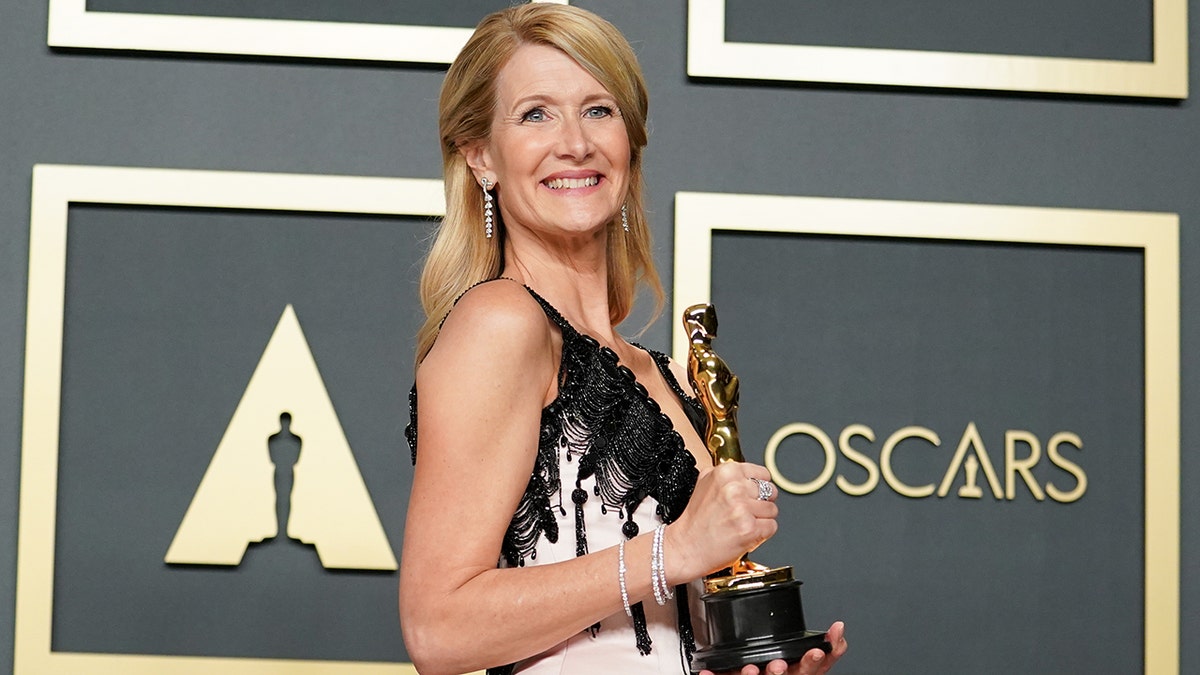 Laura Dern holding her Oscar, which she won for her role in "Marriage Story" in 2020