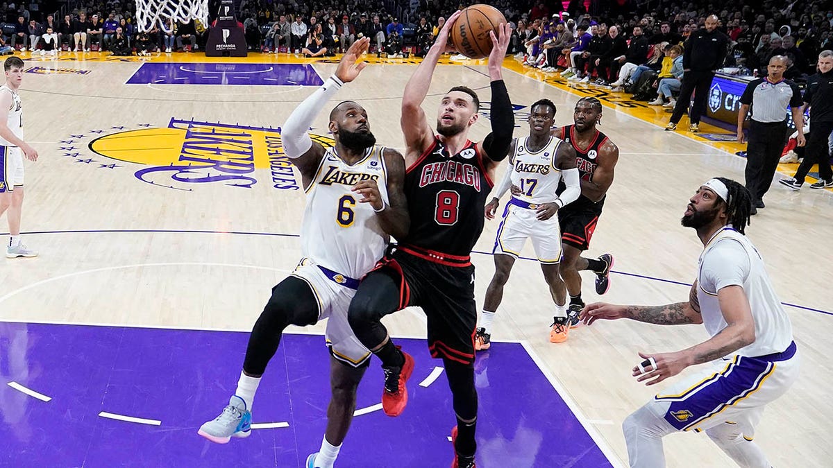 LeBron James guards Zach LaVine