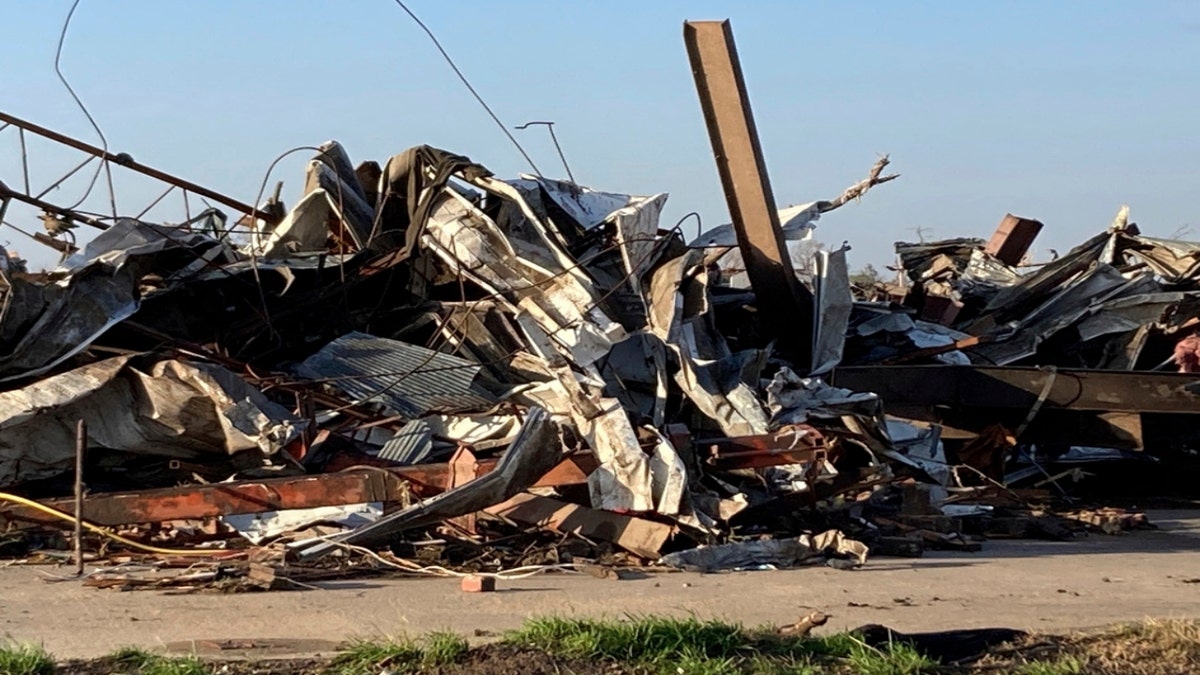 Debris covers a damaged structure in Rolling Fork, Mississippi