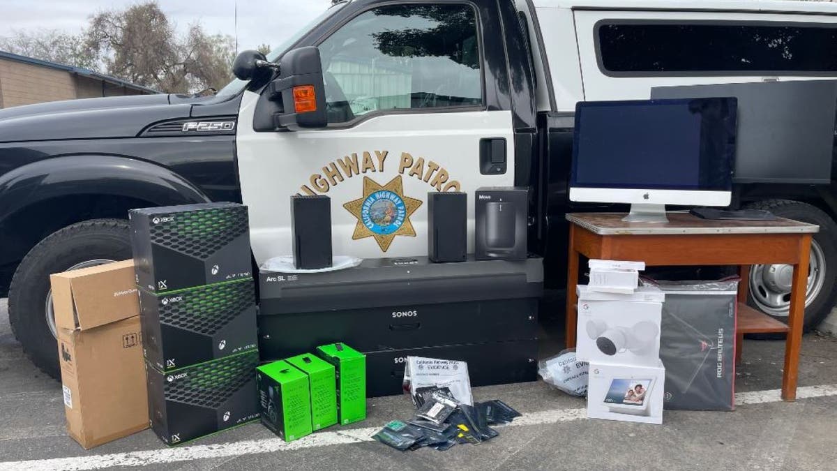 Stolen computer goods displayed on side of highway patrol vehicle