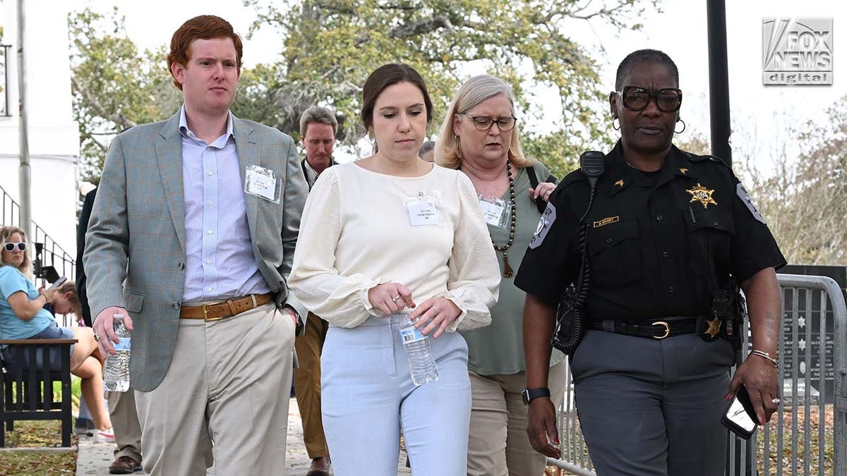 Buster Murdaugh, Brooklynn White and Lynn Murdaugh leave the Colleton County Courthouse for a lunch break