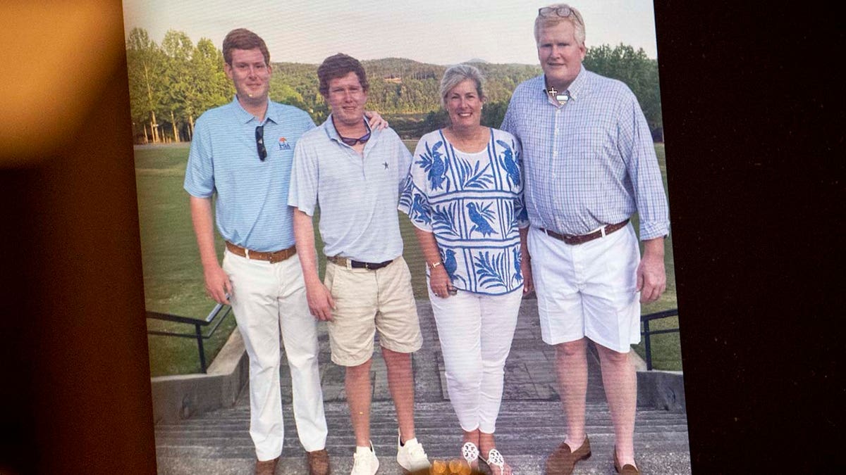 A family photo of Buster, Paul, Maggie and Alex Murdaugh displayed in a courtroom.