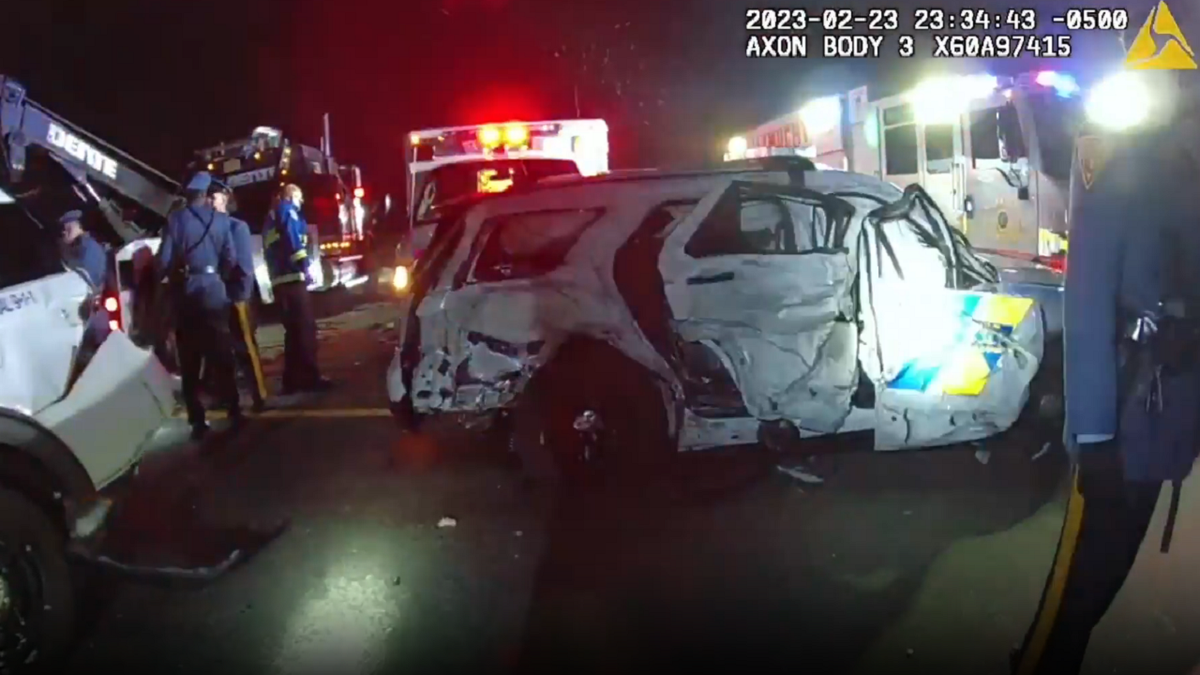 Aftermath of tow truck hitting New Jersey State Police vehicles