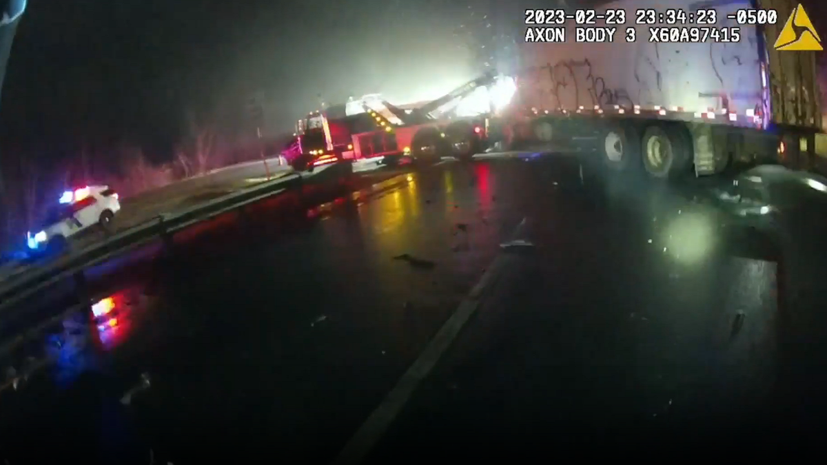 Tow truck carrying box truck crashes into New Jersey State Police vehicles