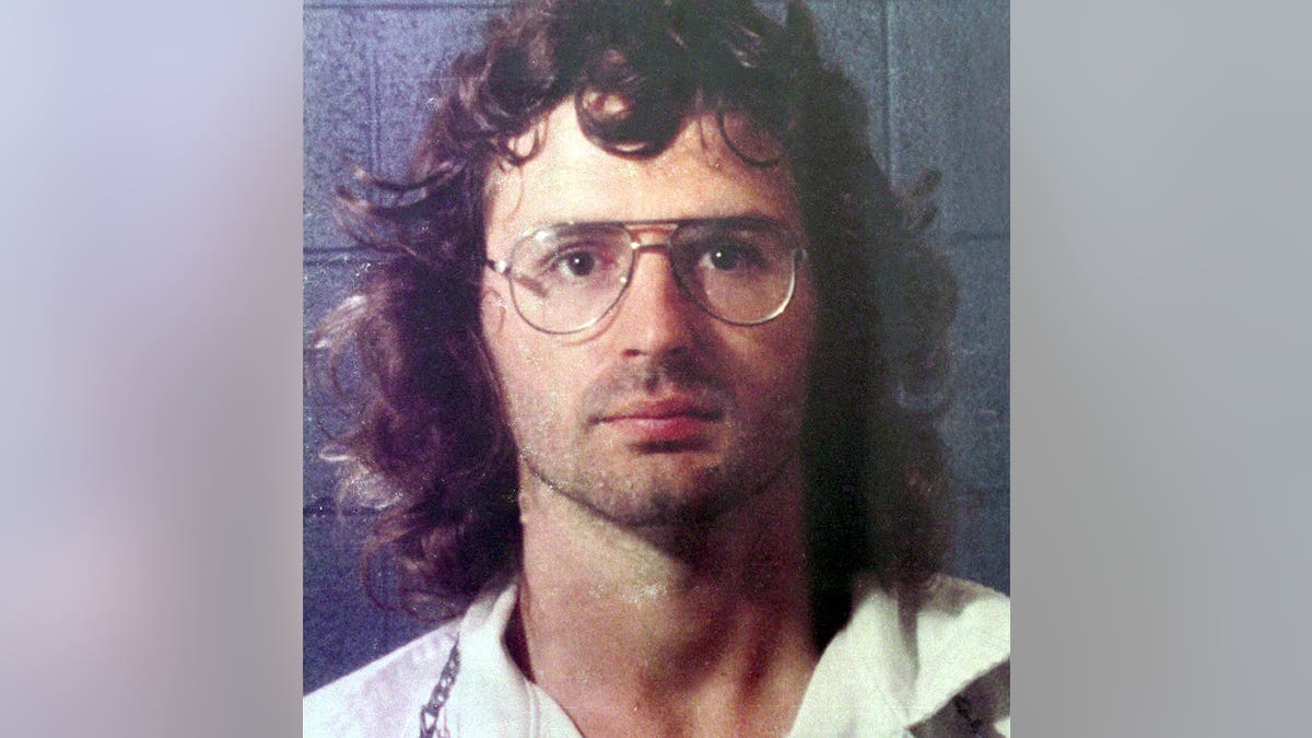 A close-up of David Koresh wearing a white shirt