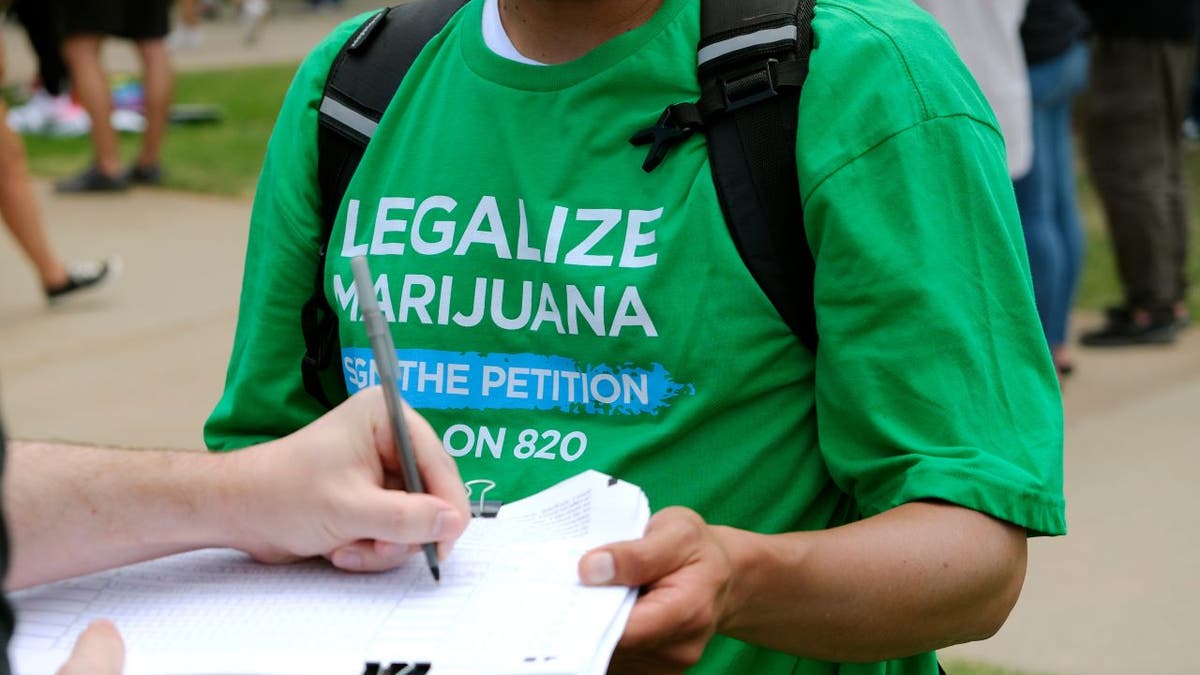Person signs legal marijuana petition
