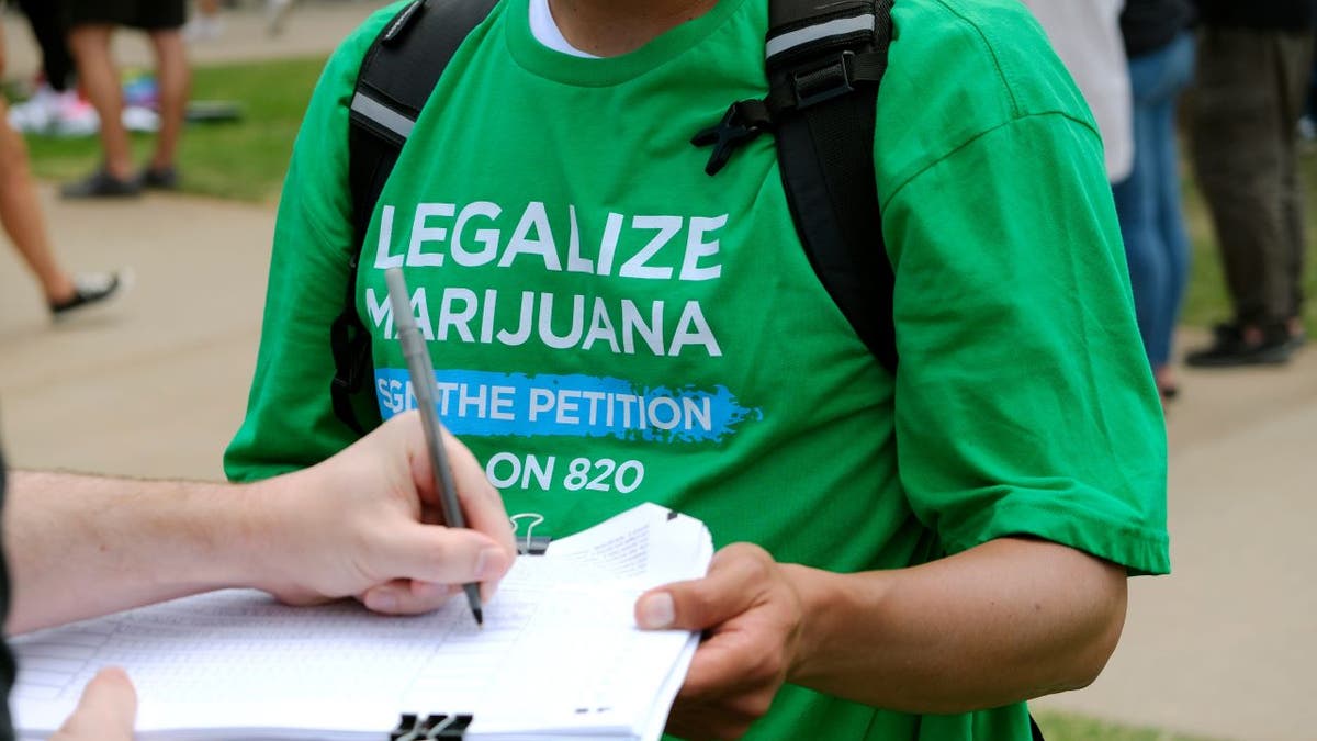 Person signs legal marijuana petition