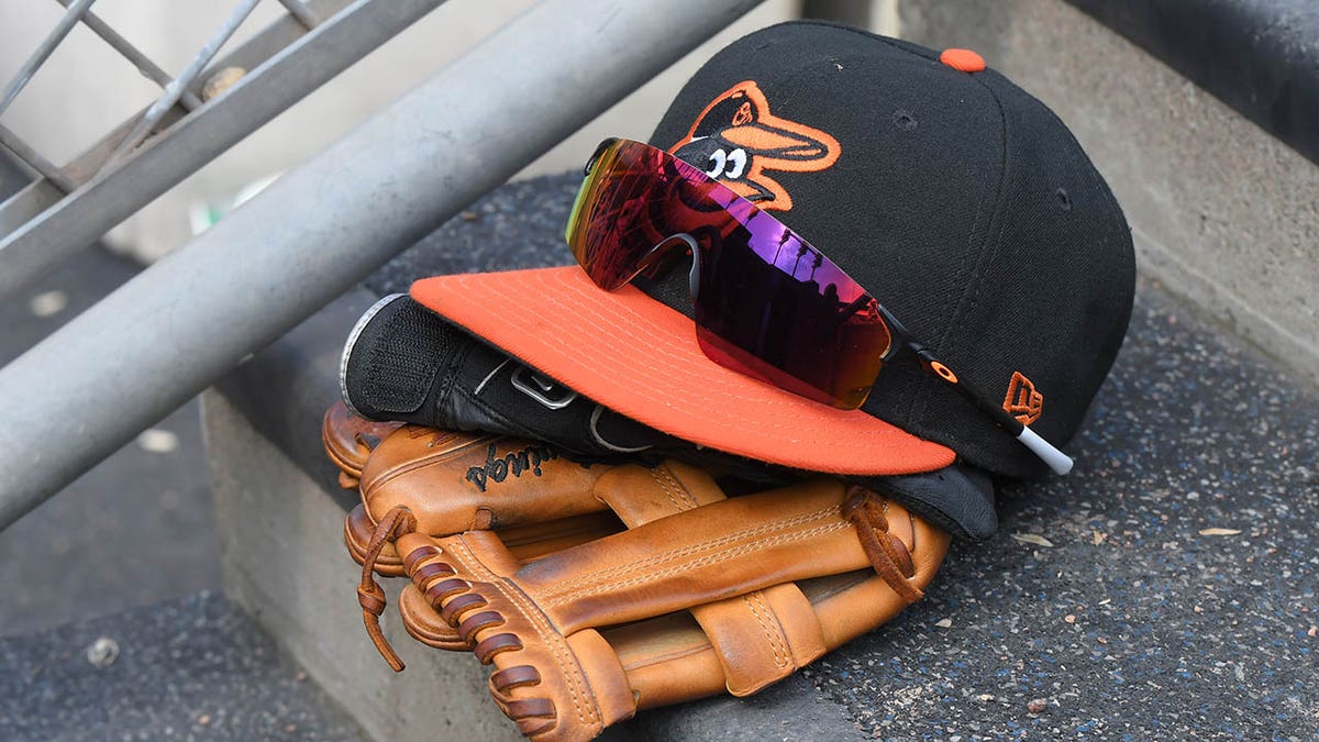 An Orioles hat and glove