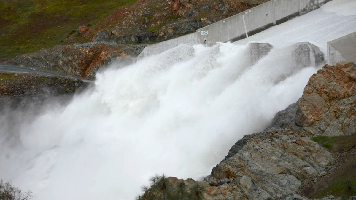 Water flows down Oroville Dam's main spillway