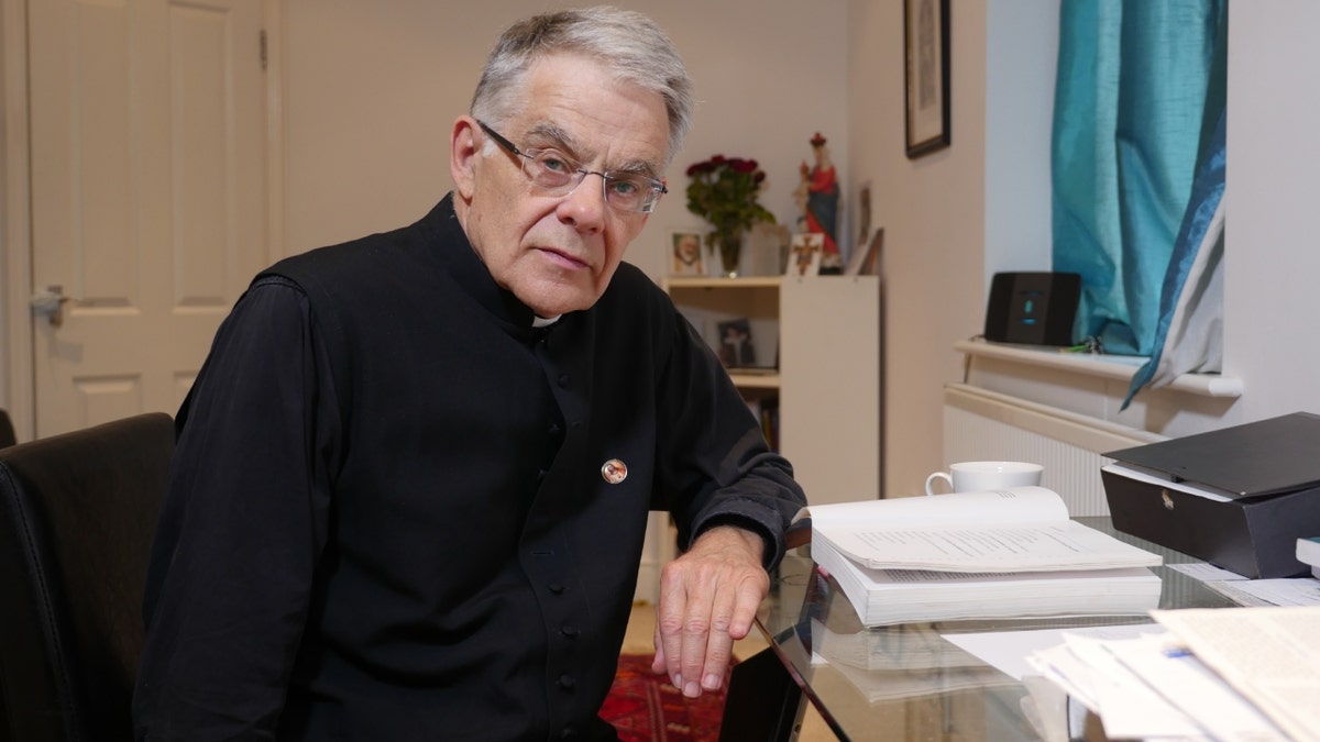 Rev. Patrick Pullicino at desk