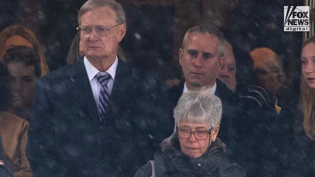 Bill Postle and Bernadette Postle, parents of Rebecca Bliefnick, attend their daughter’s funeral