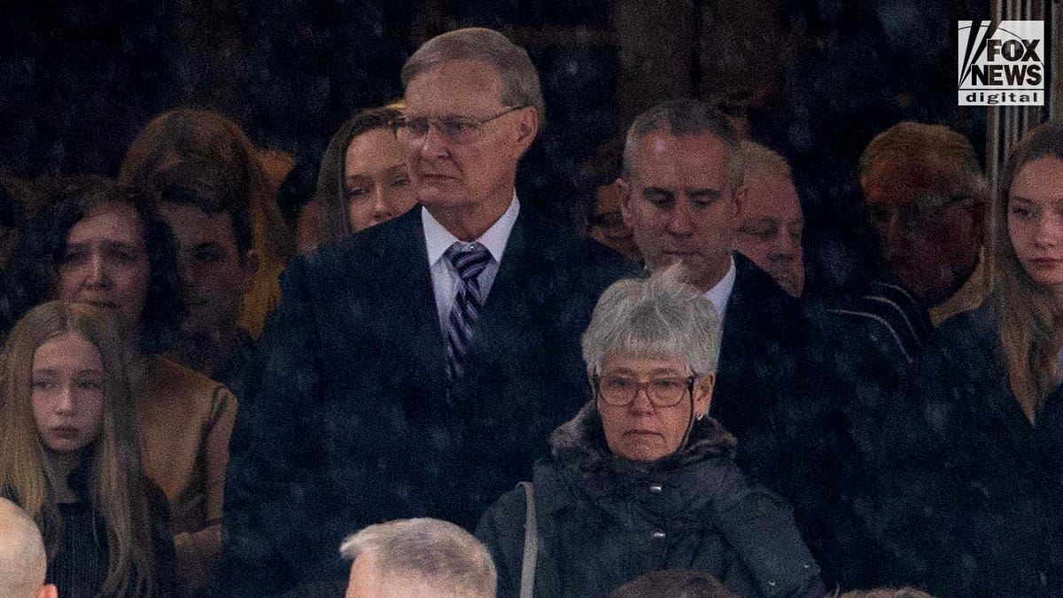 Bill Postle and Bernadette Postle, parents of Rebecca Bliefnick, attend their daughter’s funeral