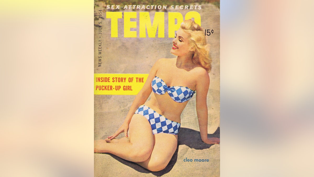 A pinup magazine cover featuring Cleo Moore