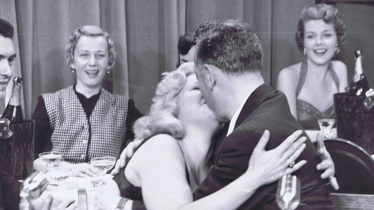 Cleo Moore kissing on live television