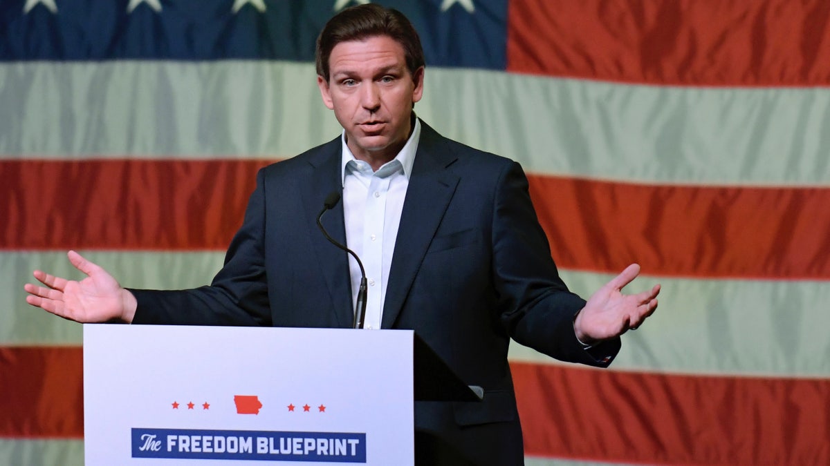 Gov. Ron DeSantis in Iowa event, US flag behind him