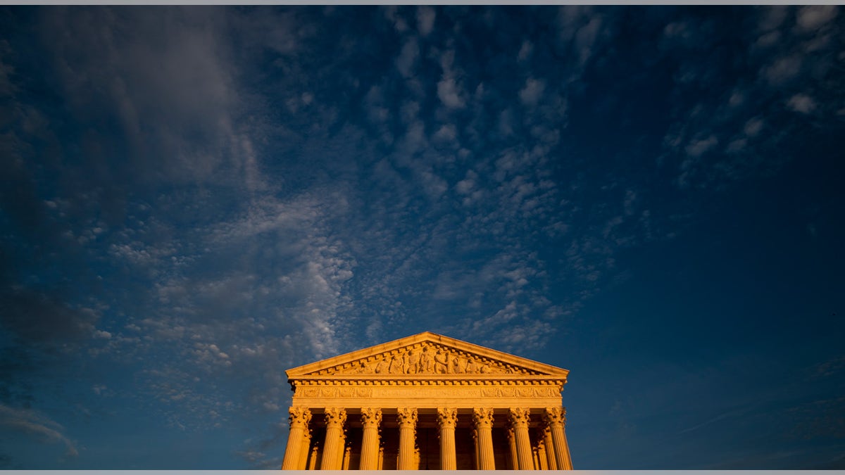 Sunset light illuminates the U.S. Supreme Court building.