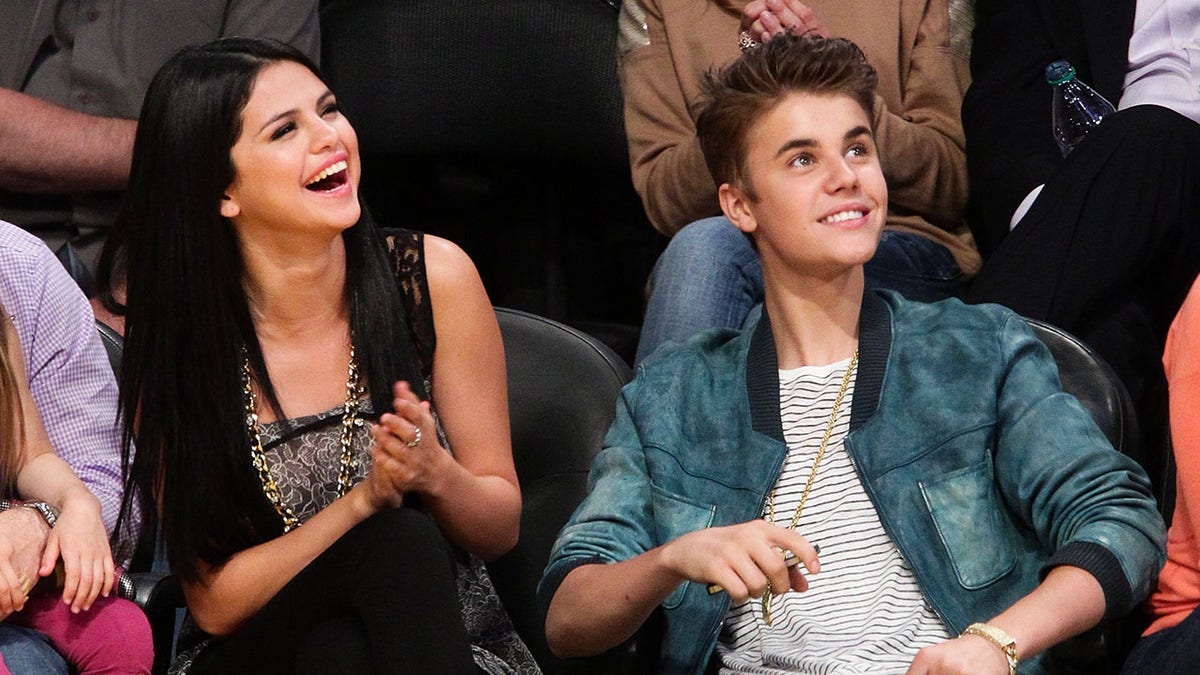 Selena Gomez and Justin Bieber sitting together