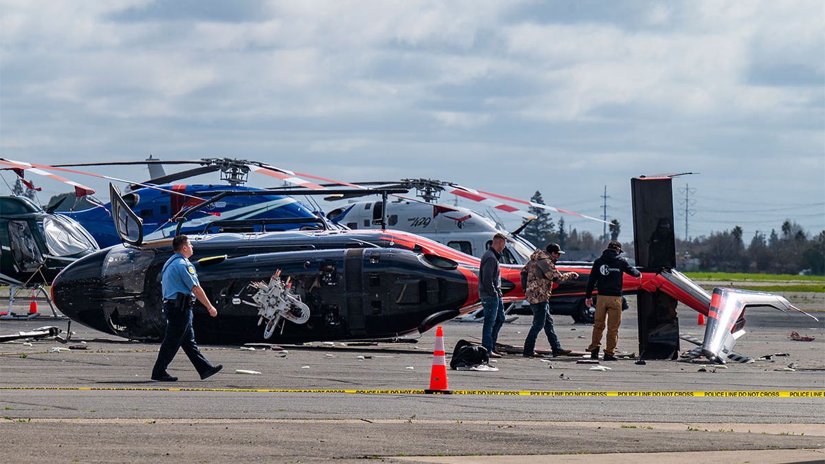 Investigators inspecting a crashed helipcopter.