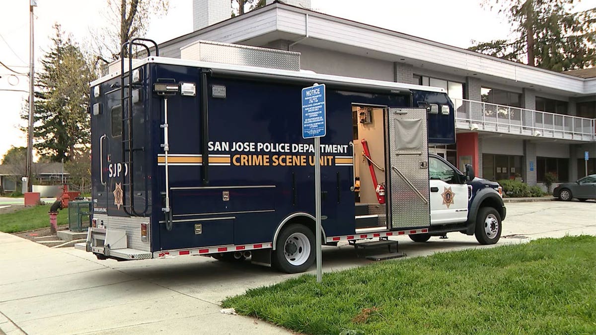 Crime Scene Unit truck parked outside.