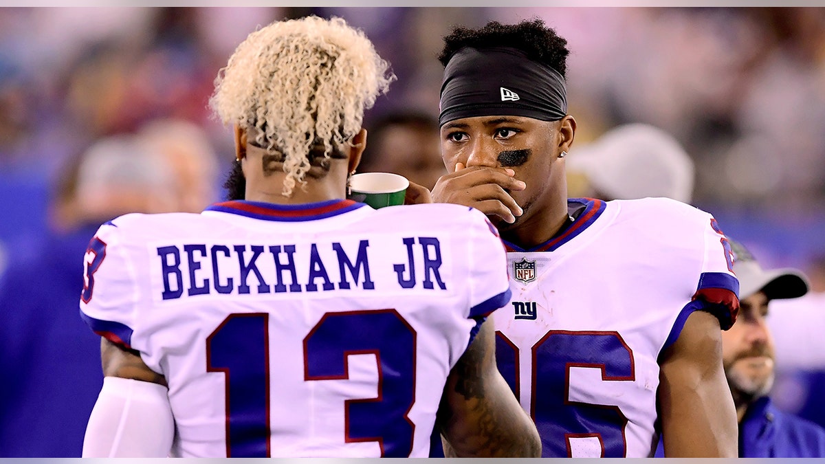 Saquon Barkley speaks with Odell Beckham Jr.