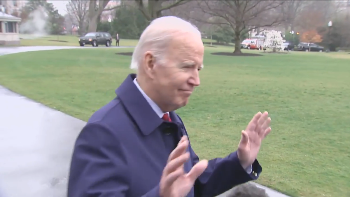 Biden with his hands up turning