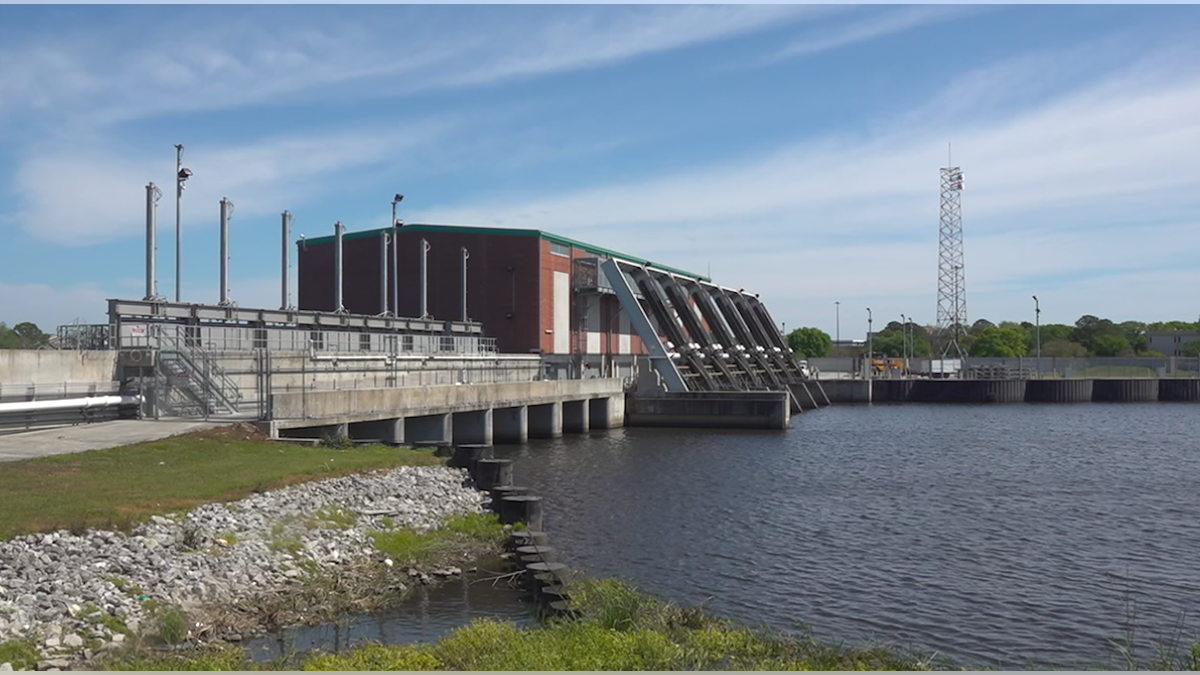 Wide shot of pump station on canal