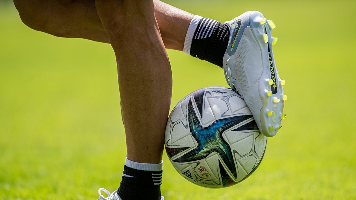 General view of soccer ball and shoes