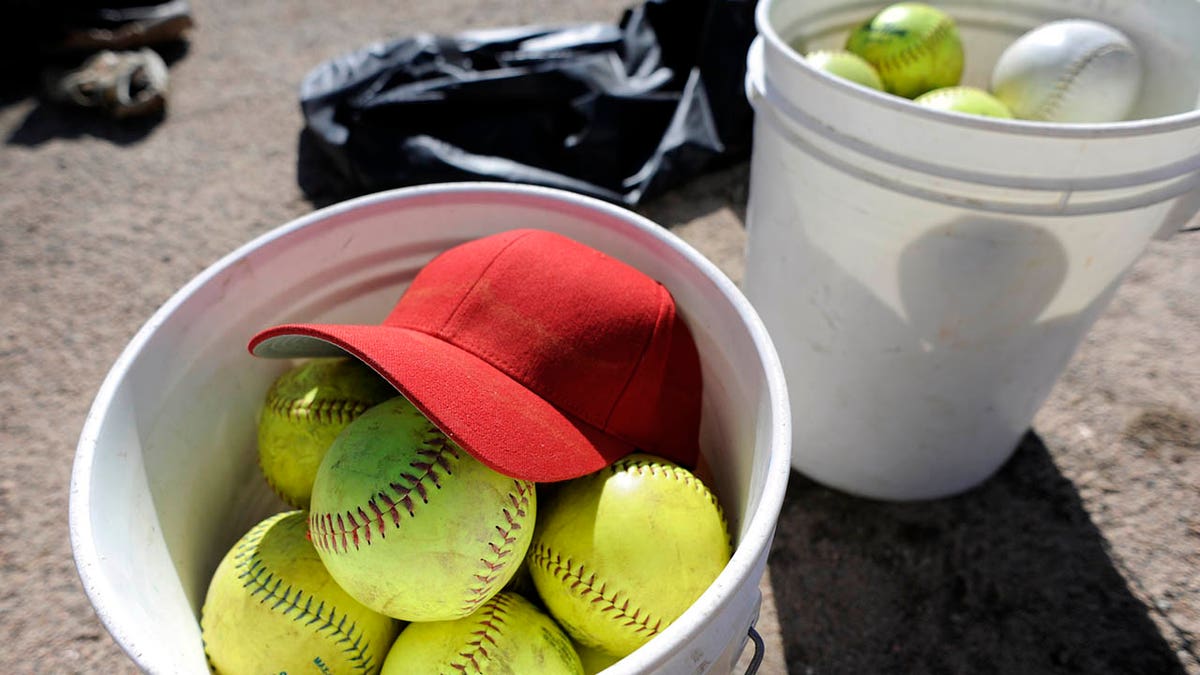 Softballs in a bucket