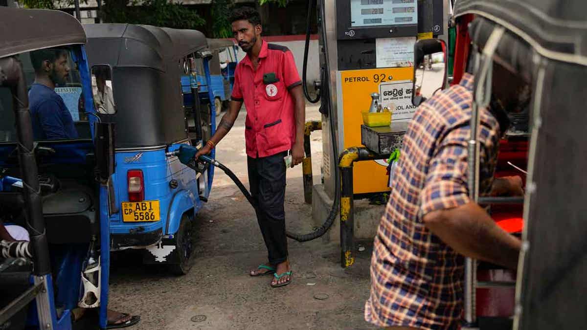 A man pumping gas