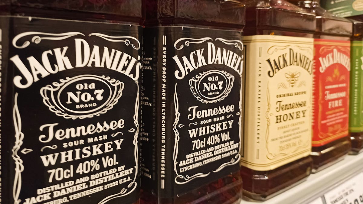 Jack Daniels bottles on a grocery shelves.