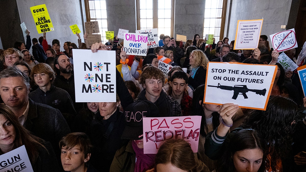 Protestors holding signs