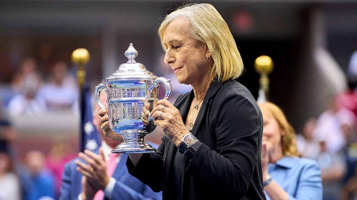 Martina Navratilova gets the championship trophy