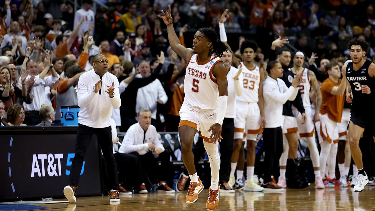 Marcus Carr reacts after scoring