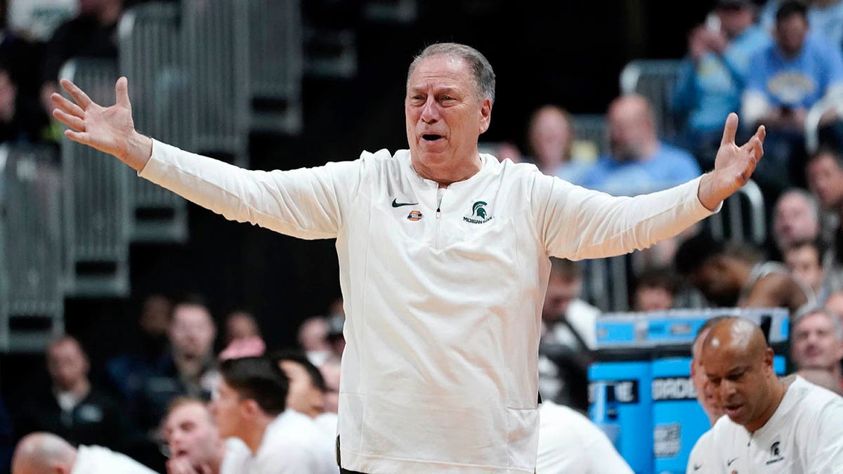 Tom Izzo argues a call