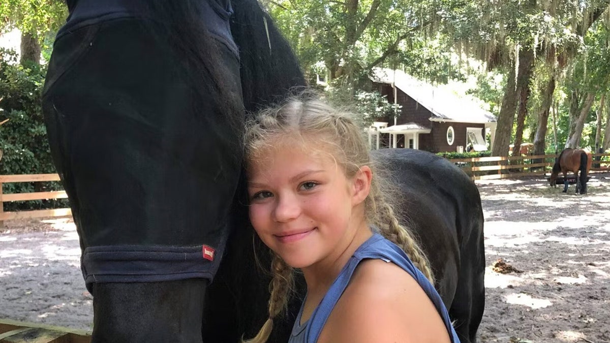 Tristyn Bailey poses with a horse
