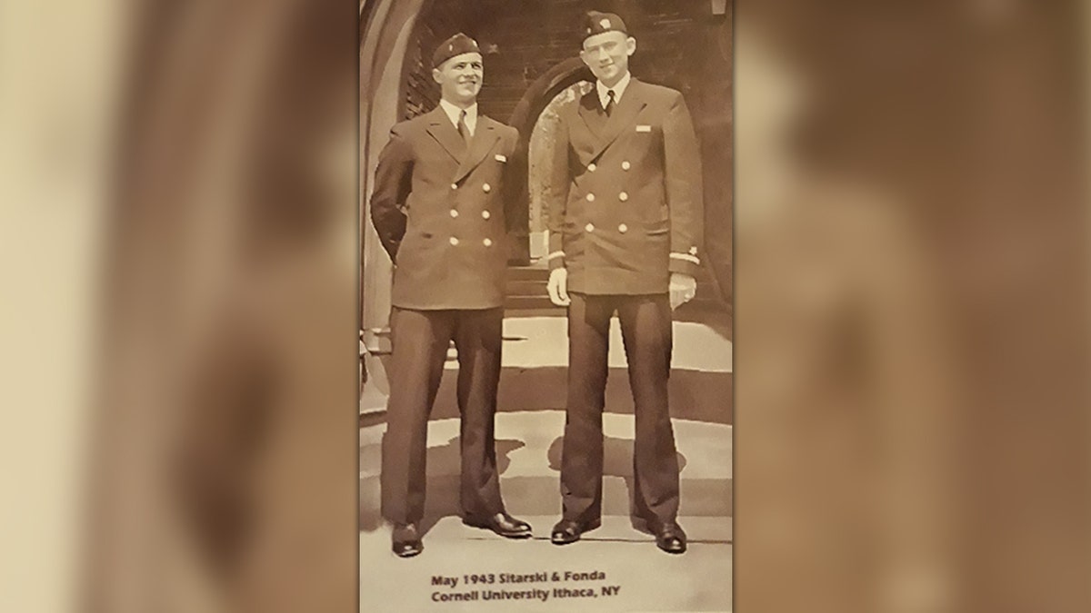 Two Navy men on the steps