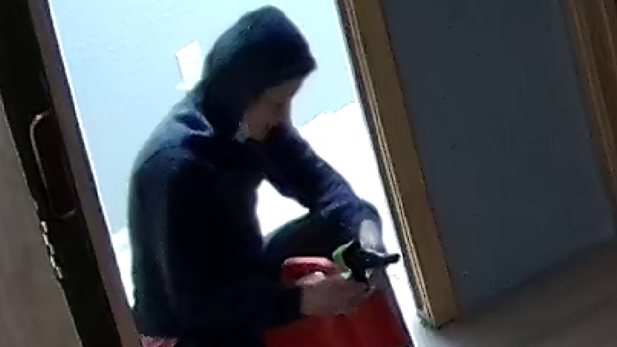 Woman holding gas can