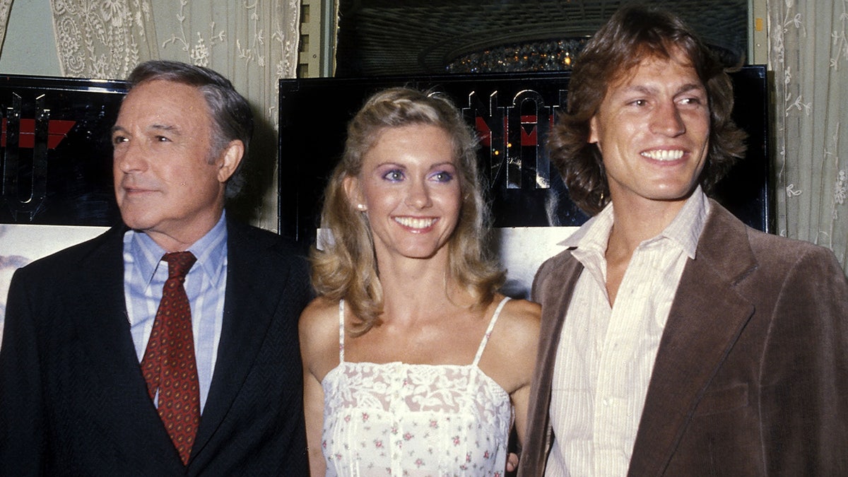Gene Kelly, Olivia Newton-John and Michael Beck at a press conference for "Xanadu."